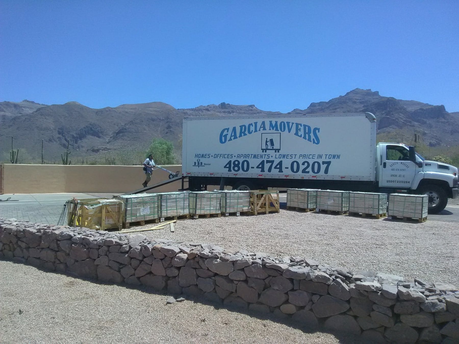 A Garcia Movers truck on the job beneath the Superstition Mountains