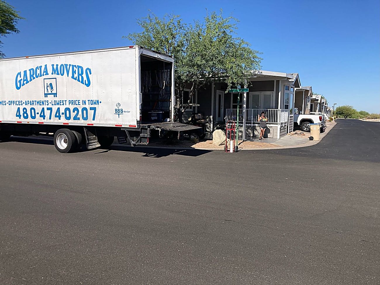 A branded Garcia Movers truck at a customer home